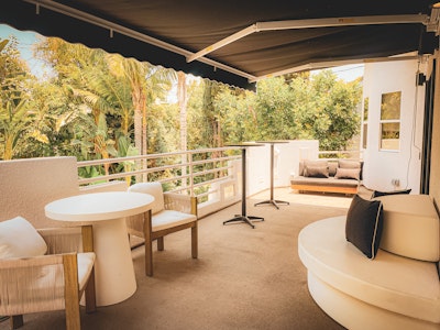 Shaded patio lounge overlooking the pool