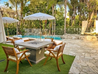 Outdoor dining set beside the pool